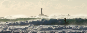 Surfing longships hands This landscape photograph captures a surfer riding the waves at Longships hands, located off the Coast of Sennen Cove in the United Kingdom. The image was taken in the afternoon during autumn, as indicated by the soft light and the timestamp of early November. In the background, the Longships Lighthouse stands tall on a rocky outcrop, silhouetted against a cloudy sky. The powerful sea is a prominent element, with large waves rolling towards the shore and a dynamic display of nature’s force. The setting highlights the connection between human activity and natural surroundings, with the lighthouse serving as a significant landmark amidst the untamed waves of the Atlantic Ocean.